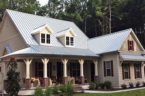 tan house with metal roofs|white house with galvalume roof.